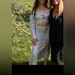 Long, white, cutout dress with colorful with colorful speckles.